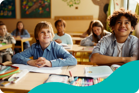 Primary students in class, smiling