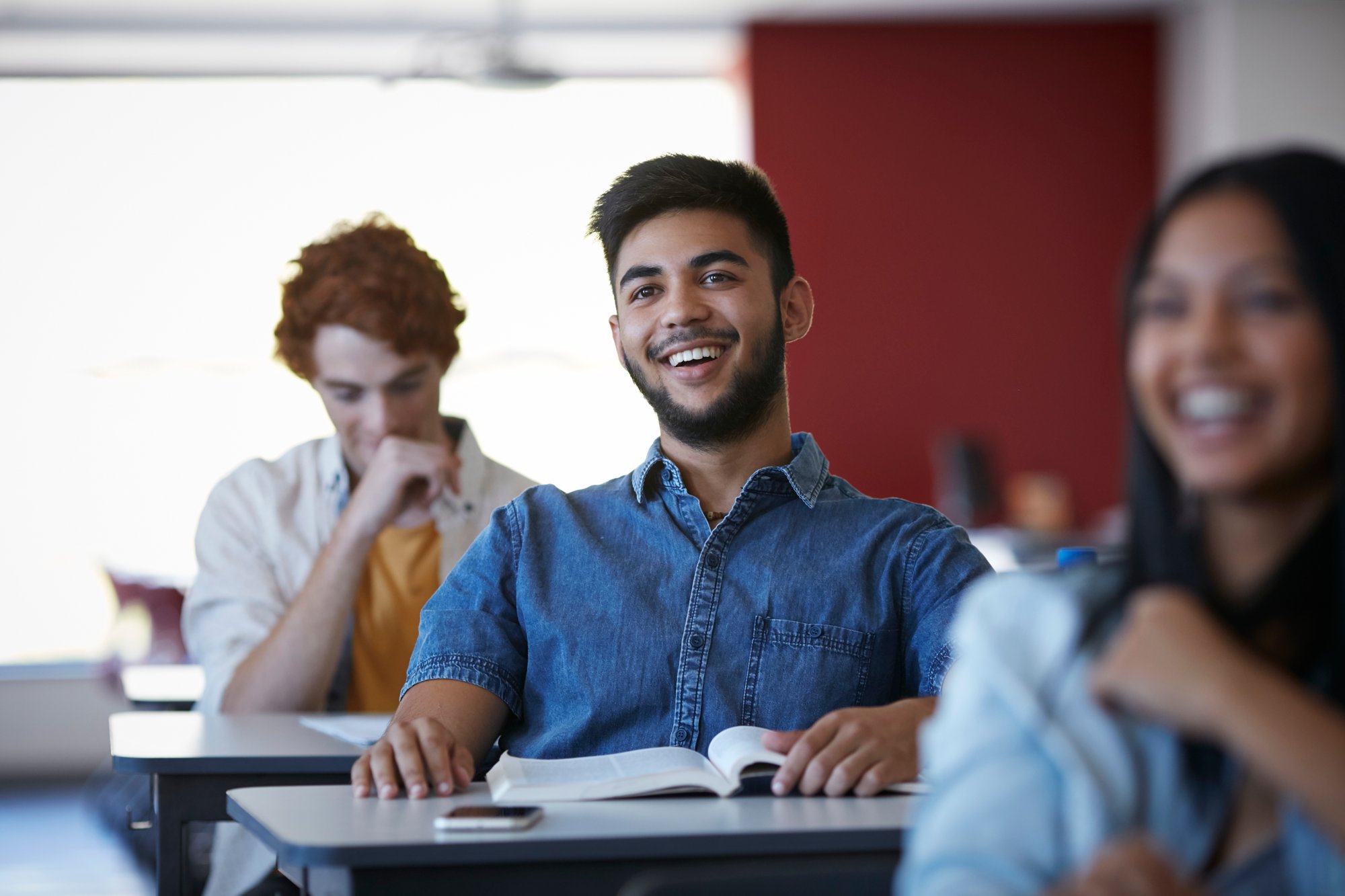 Young Adult in a class with classmates