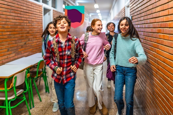 Primary students walking inside the school